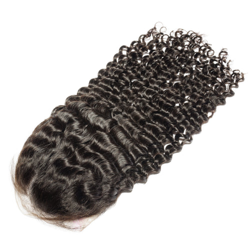 Kinky curly hair bundle with a lace closure on a white background